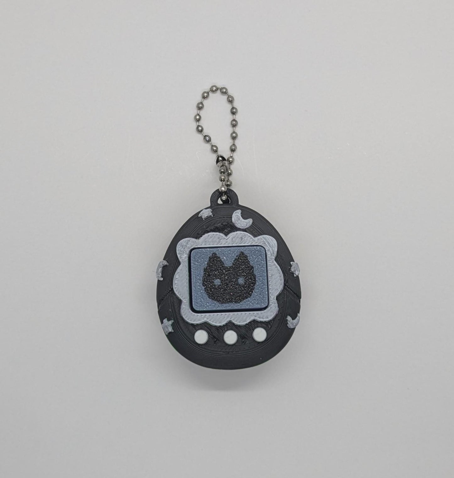 Black Tamagotchi Style Clicker Fidget with Silver Stars β Pet Face